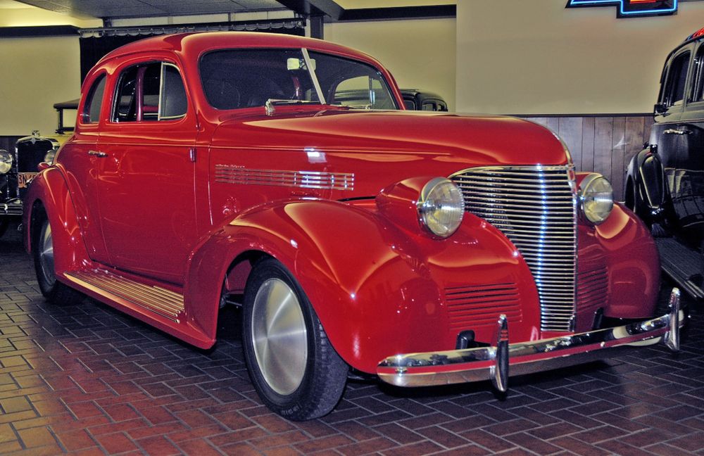 1939 Chevrolet coupe street and drag rod painted Ferrari red with chrome grille and polished wheel covers